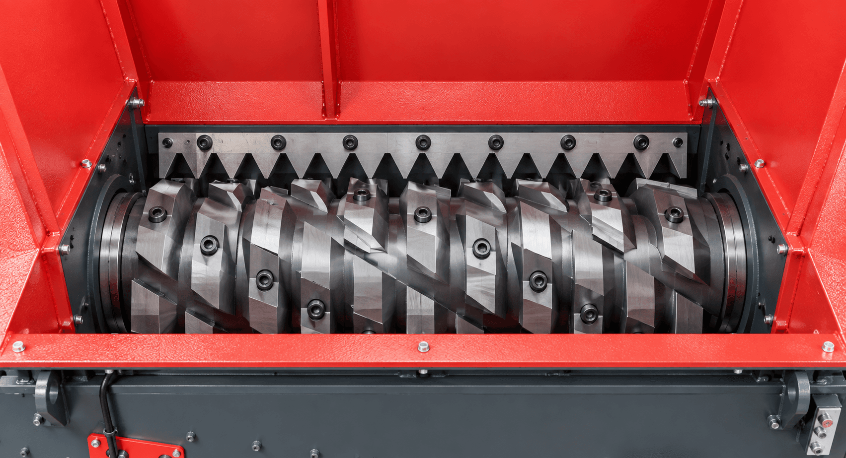 Close-up of a plastic shredder cutting chamber and rotor blades